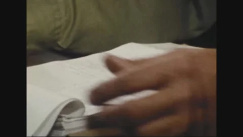 PACIFIC - 1973: Printed forms - Curled page tops a stack of forms Stock Footage 344497239