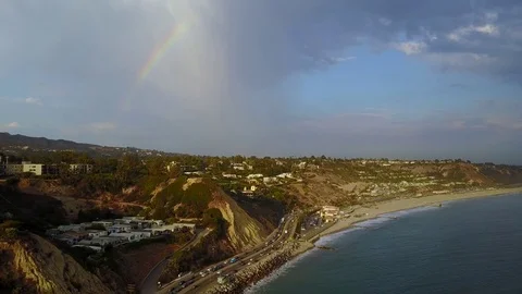 Pacific Coast Highway with rainbow in background Stock Footage 84704246