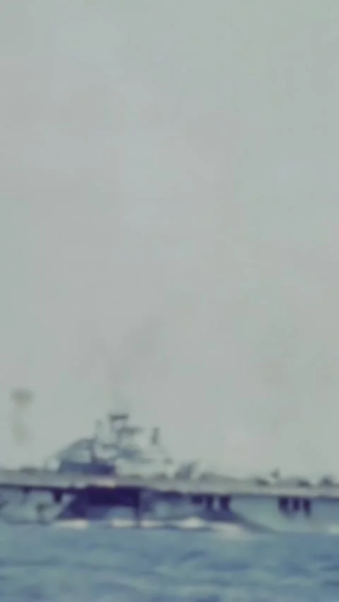 PACIFIC OCEAN - 1943 - After being attacked, US Navy ships fire down kamikaze Stock Footage 342811143