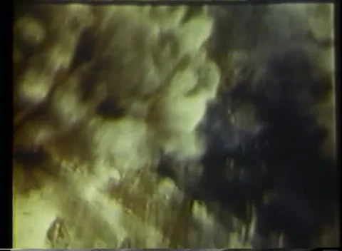 PACIFIC OCEAN - 1943: Air attack - Smoke Plume above Coastal Terrain 库存影片 343786350