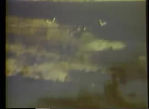 PACIFIC OCEAN - 1943: Air attack - Cloud View Smoke Plume Above Coastal Stock Footage 343786433