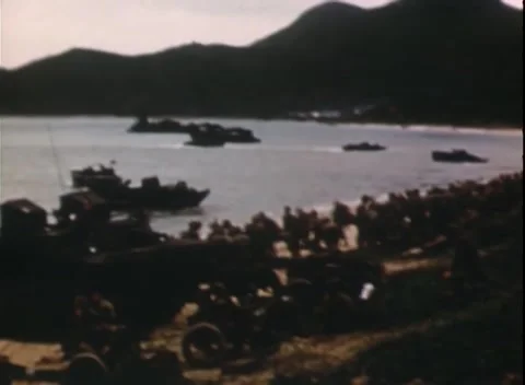 PACIFIC OCEAN - 1944: Beachhead buildup — landing craft massed along the beach Video stock 343119939