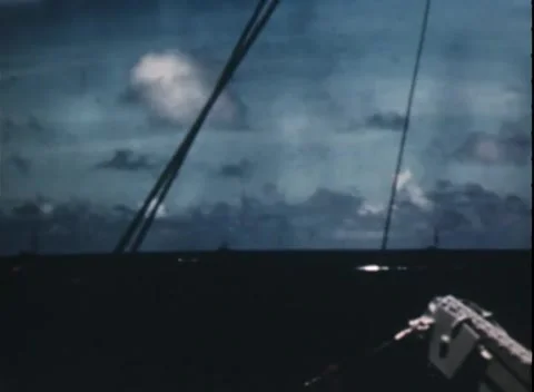 PACIFIC OCEAN - 1944: Task force passage — ship silhouetted beyond deck rigging Video stock 343119935