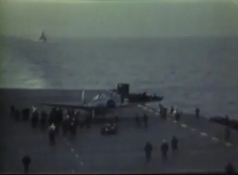 PACIFIC OCEAN - 1945: Airfield ops - Distant Along Flight Deck With Crew Stock Footage 343786220