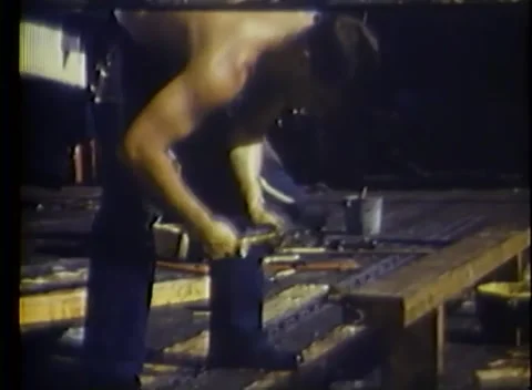 PACIFIC OCEAN - 1945: Carpentry aboard — a plank is worked on a low bench Vidéo 343119783
