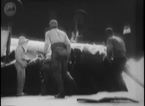 PACIFIC OCEAN - 1945: Deck fire party — foam hoses play over a crashed plane Vidéo 343119686