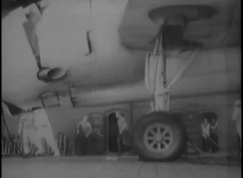 PACIFIC OCEAN - 1945: Deck handling — close on an aircraft nose and gear 库存影片 343119699