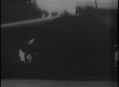 PACIFIC OCEAN - 1945: Deck handling — deck crew work beneath an aircraft nose Video stock 343119701