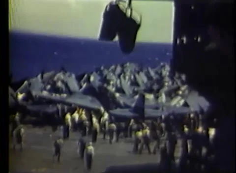 PACIFIC OCEAN - 1945: Deck park — folded-wing planes packed among the crew Stock-Footage 343120222