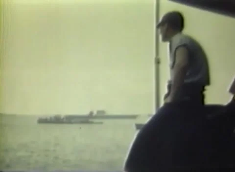 PACIFIC OCEAN - 1945: Fleet staging - Sailor Stands At Deck Edge Out Toward 库存影片 343786233