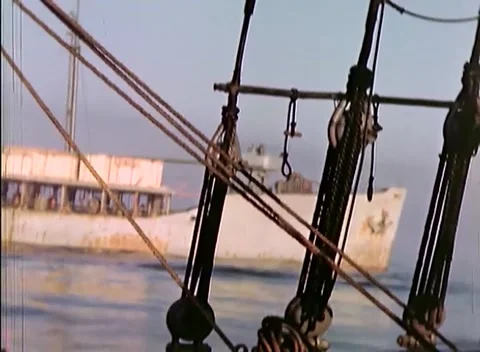 PACIFIC OCEAN - 1945: Fleet transit - Rigging Tackle above Open Water Video stock 343787027