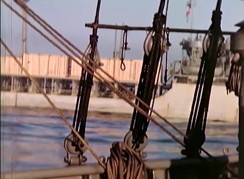 PACIFIC OCEAN - 1945: Fleet transit - Ship Rigging Rigging Tackle Above Open Video stock 343787030