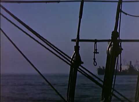 PACIFIC OCEAN - 1945: Fleet transit - Rigging Tackle against Sunset Sky Video stock 343787038