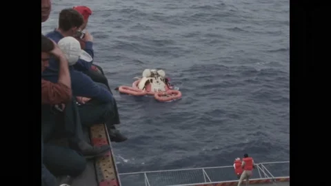 PACIFIC OCEAN - 1968 - US Navy divers approach the USS Yorktown with the Stock Footage 313053506