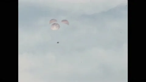 PACIFIC OCEAN - 1970 - The Apollo 13 space capsule parachutes down into the Video stock 313052837