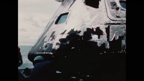 PACIFIC OCEAN - 1970 - Damage done to the Apollo 13 command module is assessed Video stock 304157393