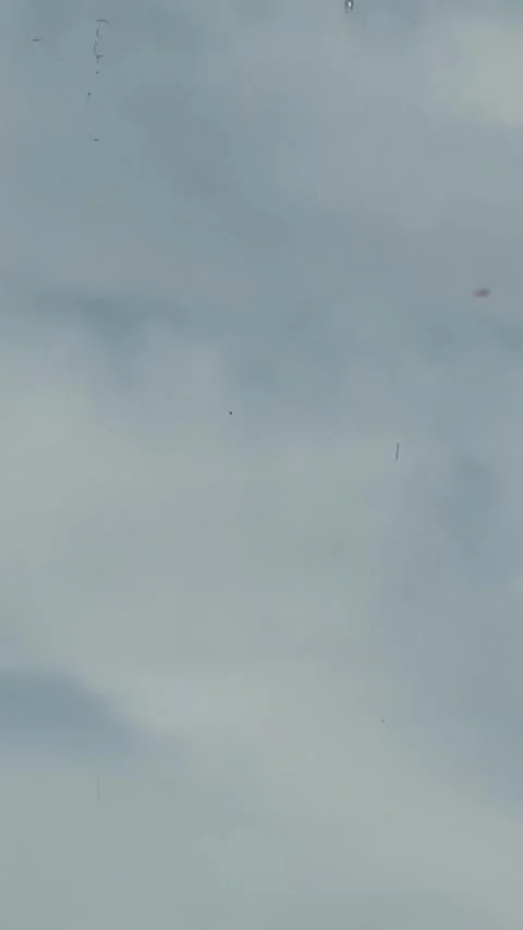 PACIFIC OCEAN - 1970 - Distant view of US Navy pilots parachuting into the Video stock 340300257