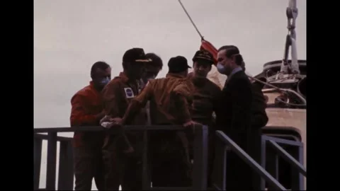 PACIFIC OCEAN - 1973: Deck gathering - Orange flight suits by Skylab 2 capsule 動画素材 347642382
