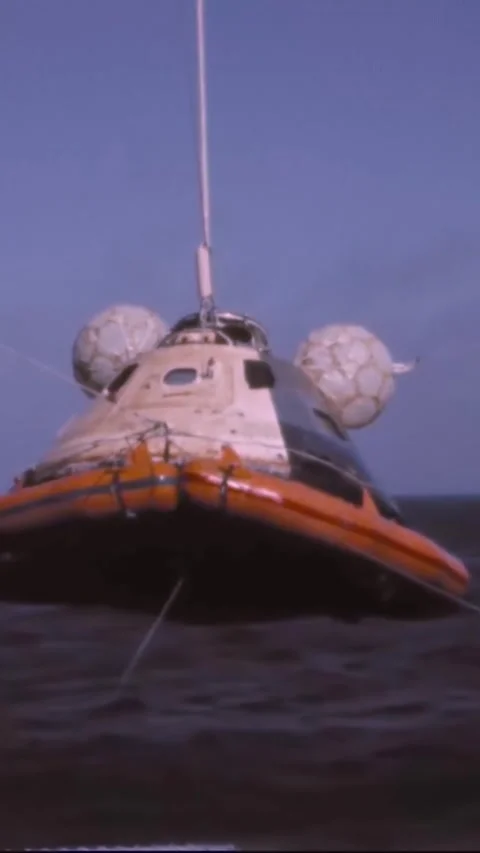 PACIFIC OCEAN - 1973 - The Skylab 2 command module is brought up to the USS Stock Footage 342675801