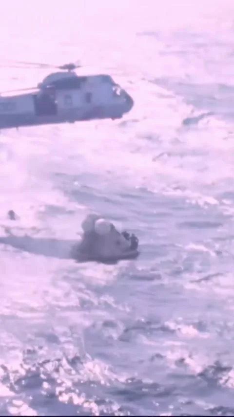 PACIFIC OCEAN - 1973 - US Navy helicopters drop ropes to the Skylab 2 command Stock Footage 342675759