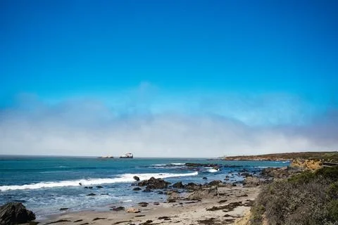 Pacific ocean beach with rocks Stock Photos