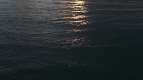 Pacific Ocean Tilting up to Sunset with Clouds Surfer Stock Footage 274228553