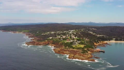 Pacific ocean view of Tathra town cape and beach – aerial hovering as 4k. Stock Footage 196806190