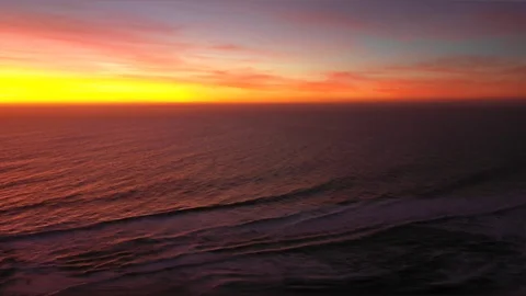 Pacific Ocean waves approaching Chile coastline during sunset, awe scenics Видео 117064116