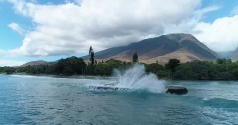 Pacific Ocean waves crash into jetty in tropical Maui Hawaii. Stock Footage 134845133