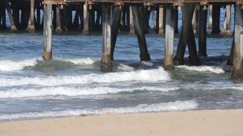 Pacific Ocean Waves Crash Into Pier Pilings Stock Footage 315141738