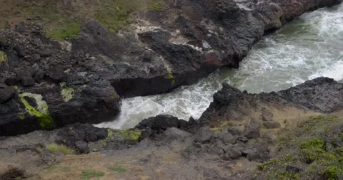Pacific ocean waves hitting against narrow opening of land - 4K Nature Stock Footage 221200432