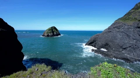 Pacific ocean waves hitting sea stacks during day Stock Footage 76891133