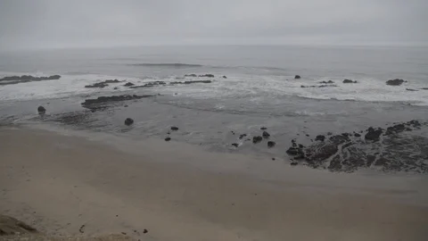 The pacific ocean waves on a rocky beach in Santa Cruz Stock Footage 91276508
