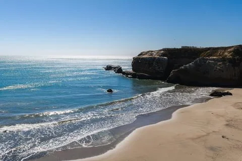 Pacific Ocean waves roll onto sandy beach at Franklin Point Stock Photos