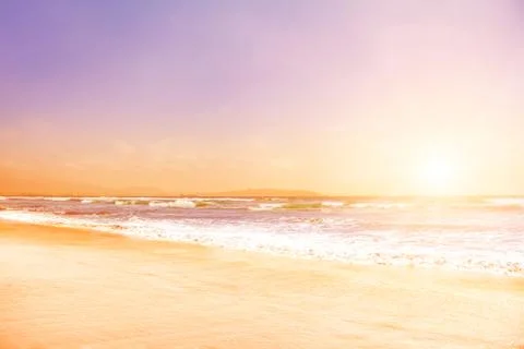 Pacific ocean waves at sunset Stock Photos