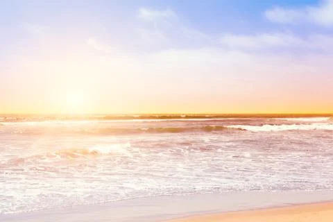 Pacific ocean waves at sunset Stock Photos