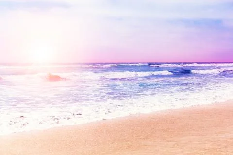 Pacific ocean waves at sunset Stock Photos
