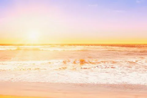 Pacific ocean waves at sunset Stock Photos
