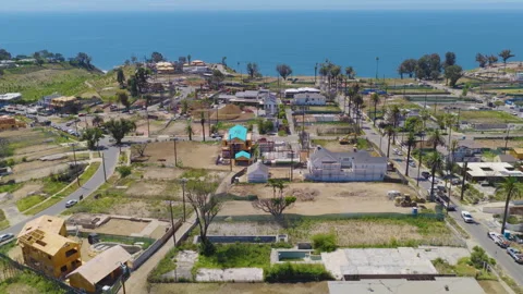 Pacific Palisades Coastal Aerial Pullback View of Rebuilding Homes 01 Stock Footage 334580835