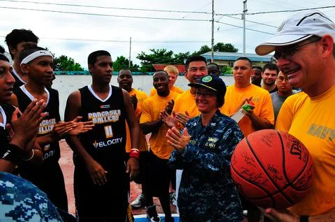 Pacific Partnership 2010 Commander Capt. Lisa M. Franchetti hands off the g.. Stock Photos