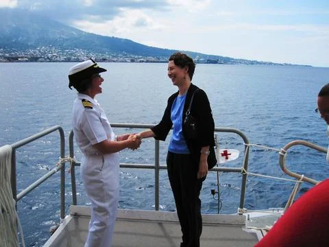 Pacific Partnership 2010 Commander Capt. Lisa Franchetti shakes hands with .. Stock Photos