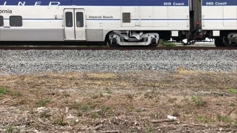Pacific Surfliner Train Passes Through Carpenteria California 4K 30 fps Stock Footage 127123595
