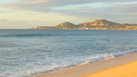 Pacific waves rolling onto shore in Los Cabos Mexico beach A Stock Footage 120400194