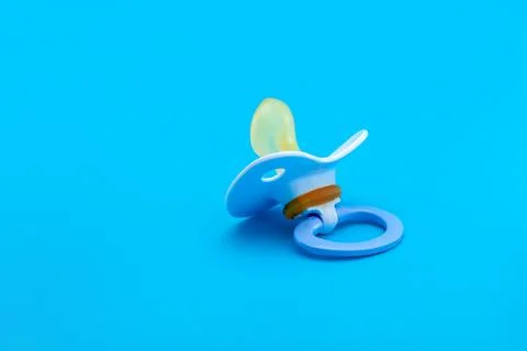 A pacifier with a bite for babies made of soft silicone. Stock Photos