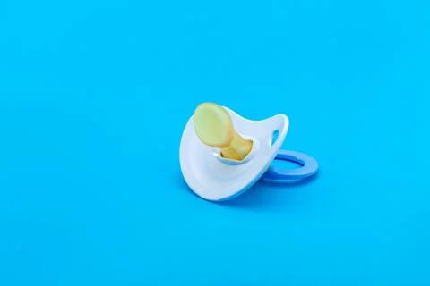 A pacifier with a bite for babies made of soft silicone. Stock Photos