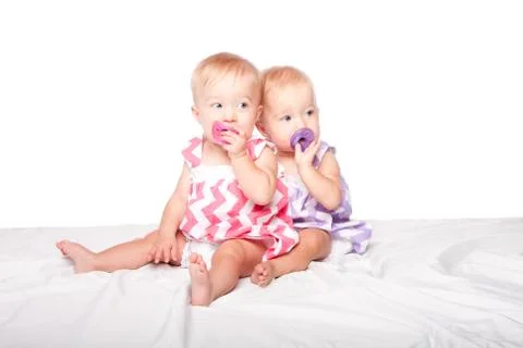 Pacifier twins Stock Photos