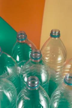 A pack of 8 empty and recyclable plastic water bottles, with no caps, blue se Stock Photos