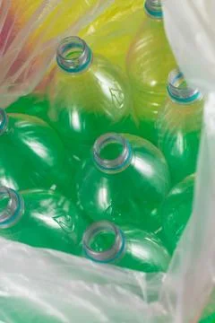 A pack of 8 empty and recyclable plastic water bottles, with no caps, blue se Stock Photos