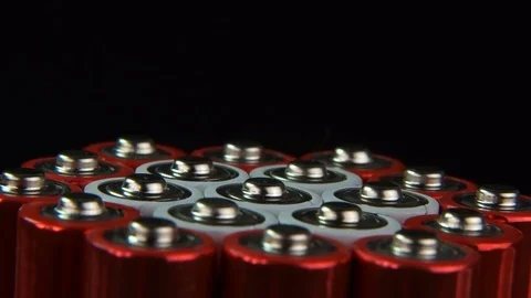 A pack of AA batteries, extremely close-up, slow rotation. Batteries are red  Stock Footage 85456882