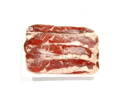 Pack of beef slice isolated on white background Stock Photos